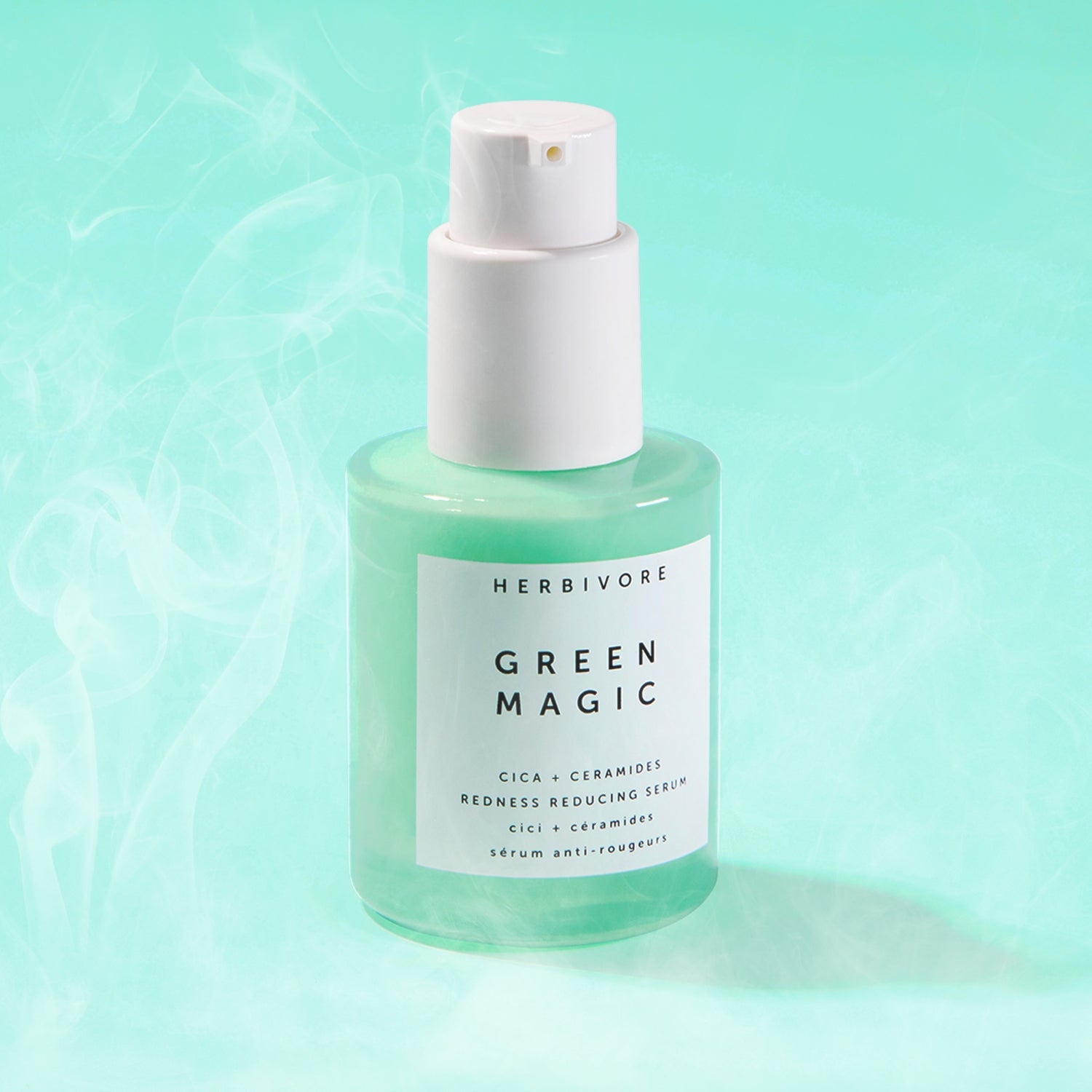 Green bottle of Green Magic Serum against a smoky, light green background