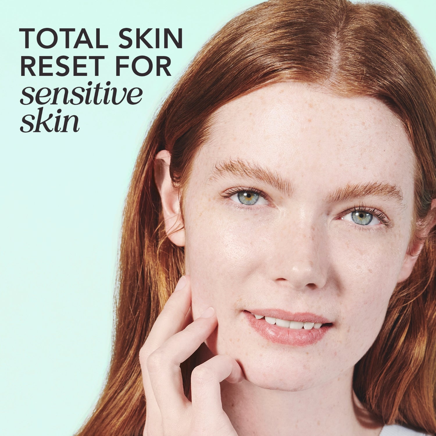 Woman with red hair with text that reads 'total skin reset for sensitive skin'