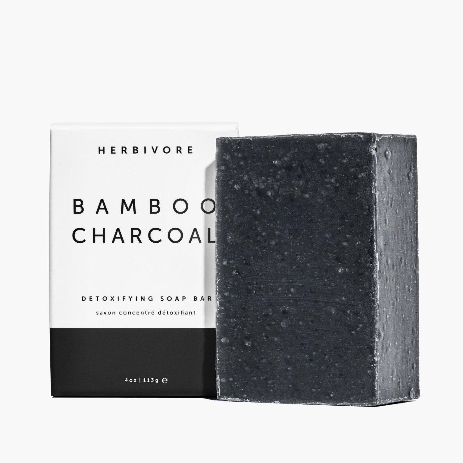 Black Bamboo Charcoal Detoxifying Soap Bar next to outer box