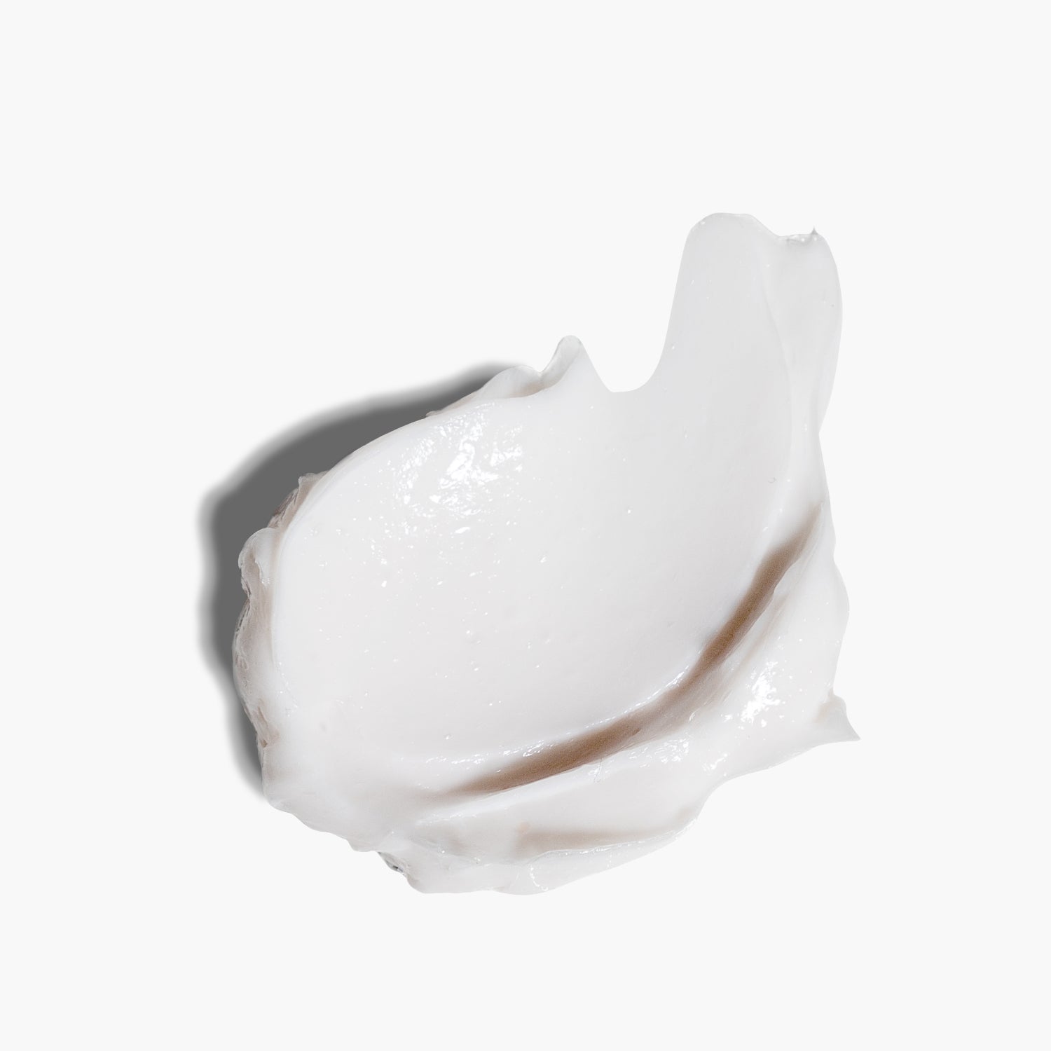 Close-up smear of white Cloud Milk Body Cream